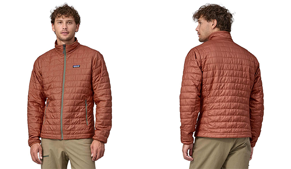 Man standing in a rust red colored insulated Patagonia jacket.
